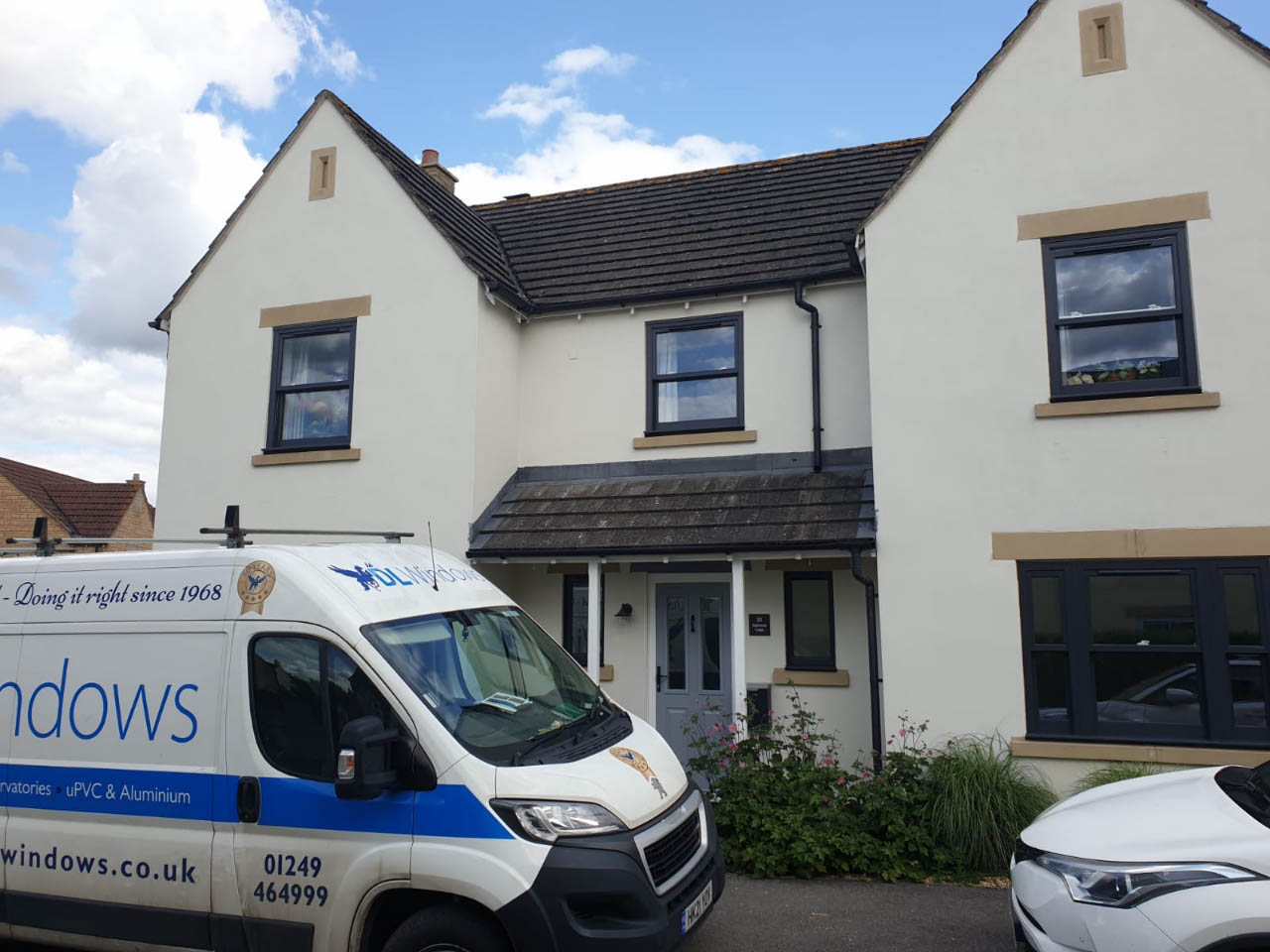 DL Windows parked outside a home with casement windows