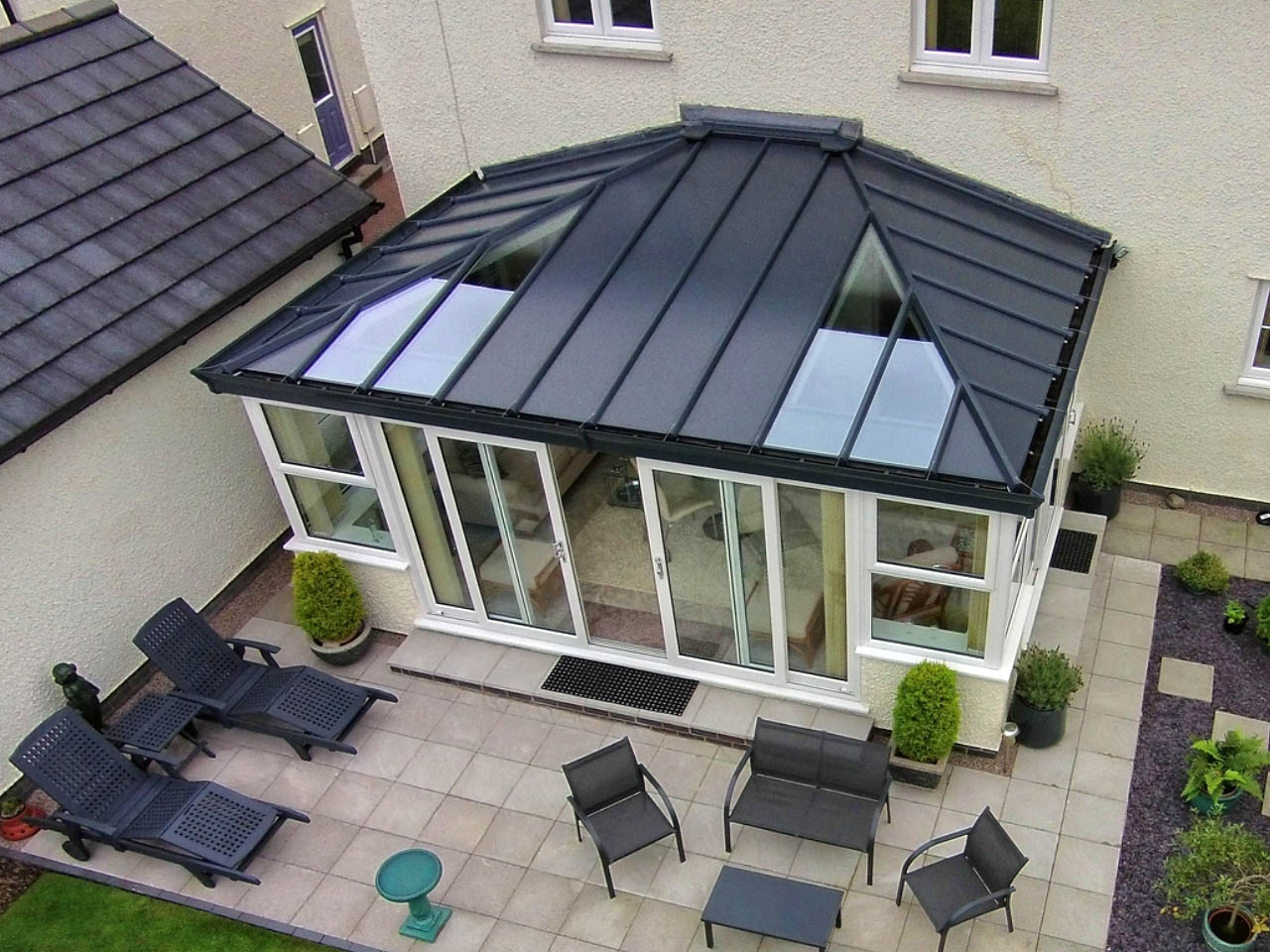 black conservatory roof with glass panels
